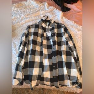 Black and white plaid flannel with design on back never worn